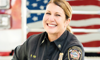 Fire Chief Lee in front of American flag