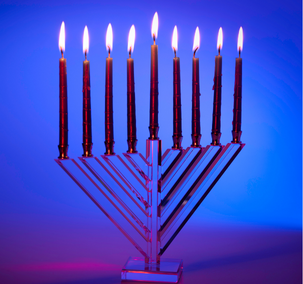 Candlelit menorah with blue background