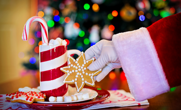 Santa hand grabbing a cookie