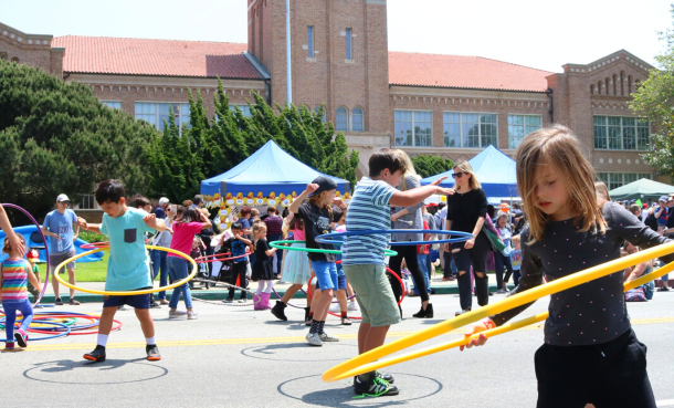 Kids hula hooping in front of ES High School