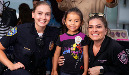 ESPD officers with a young child at National Night Out