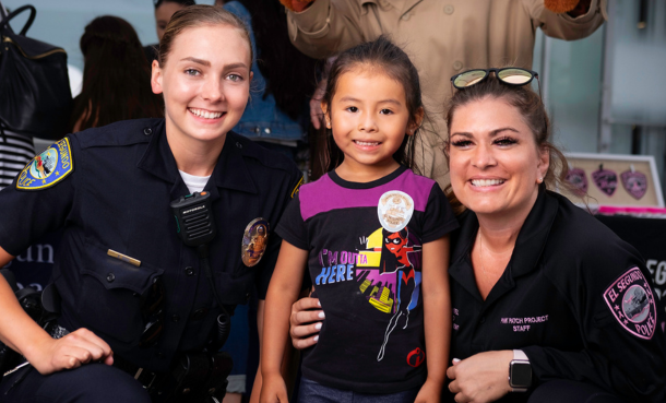 ESPD officers with a young child at National Night Out