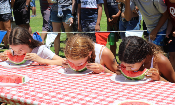 kids competing in a watermelon eating contest