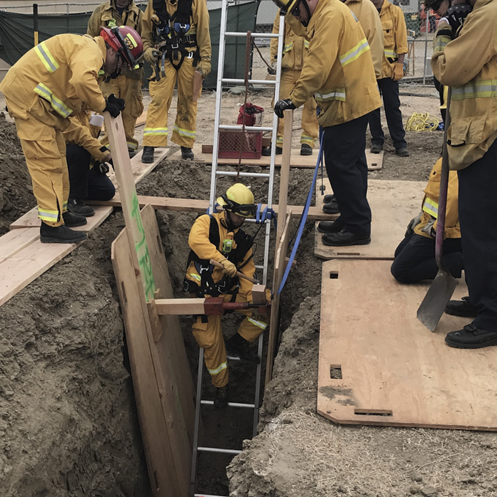 firefighters perform a trench rescue